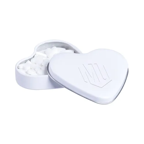 Heart shaped tin with embossing and filled with peppermint Heart shaped tin with embossing and filled with peppermint