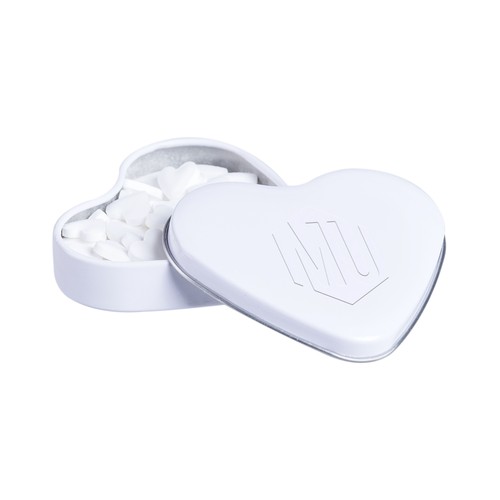 Heart shaped tin with embossing and filled with peppermint Heart shaped tin with embossing and filled with peppermint