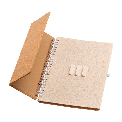 Carnet à anneaux en liège transformable en support pour téléphone portable.