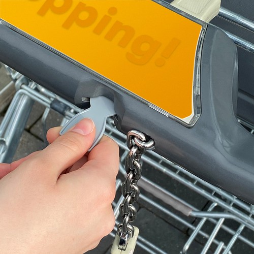 Recycling shopping trolley releaser