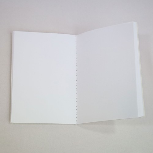 Fully recycled A6 notebook with customizable stitching. Fully recycled A6 notebook with customizable stitching.