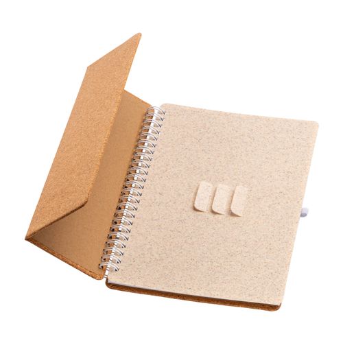 Carnet à anneaux en liège transformable en support pour téléphone portable.