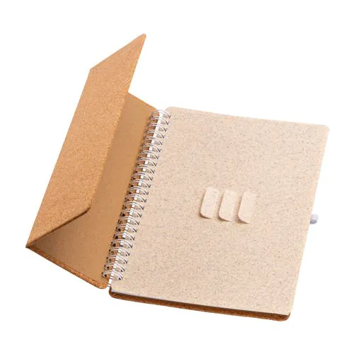 Carnet à anneaux en liège transformable en support pour téléphone portable.